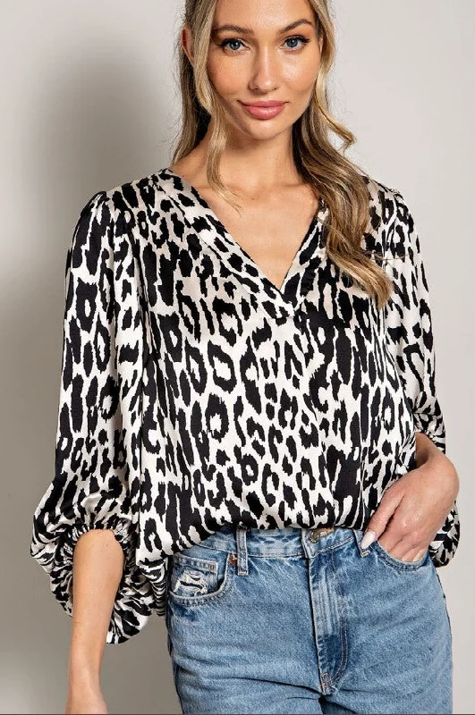 Versatile outfits to transition from day to night   Black Leopard Pattern V neck