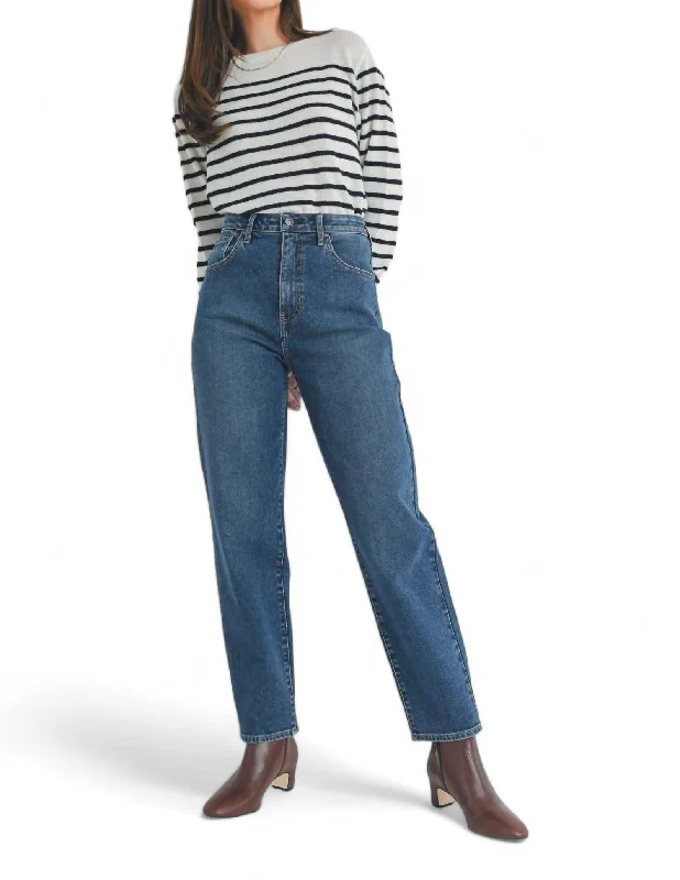 Effortlessly chic fashion for today’s woman   High Rise Tapered Barrel Jean In Dark Wash